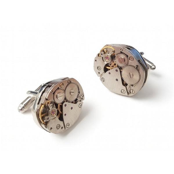 Ovale manchetknopen met zichtbaar horlogemechaniek