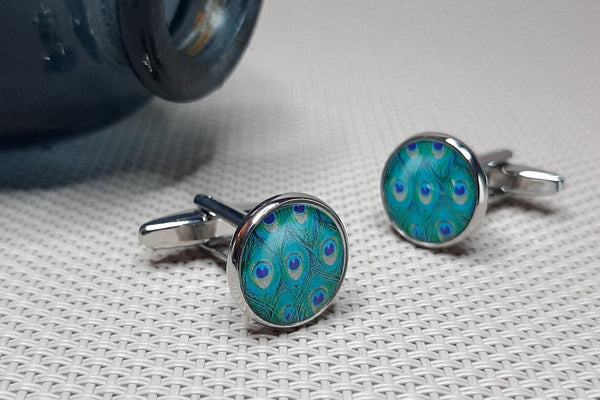 Manchetknopen Pauwenogen Veer